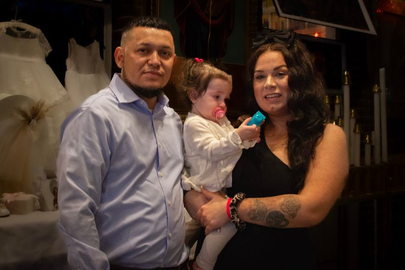 Christening day — parents with their daughter