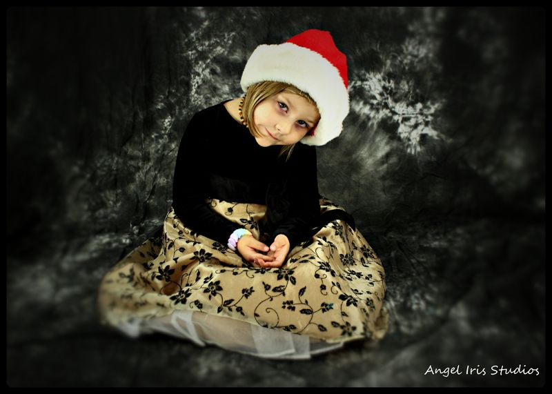 Christmas 2014 — portrait in the Santa hat (as Angel Iris)