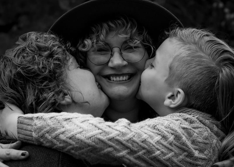 The Cochrine family — a kiss for Mom, in black and white