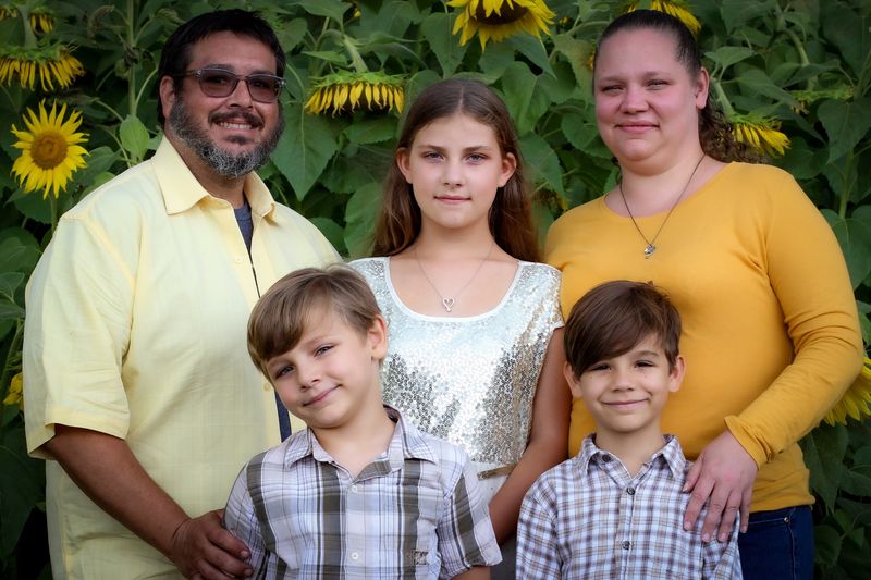 Sunflower festival — family portrait in the sunflower field